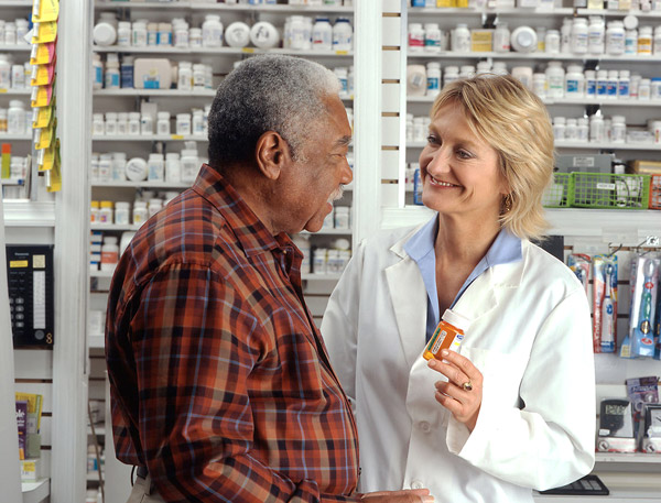 man-at-pharmacy-discussing-medicare-part-d